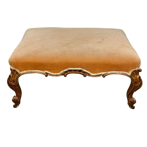 1074 - A large Victorian country house stool in walnut and on Cabriole legs, 90cm x 63cm