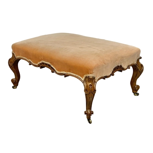 1074 - A large Victorian country house stool in walnut and on Cabriole legs, 90cm x 63cm