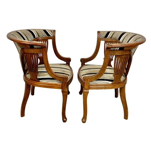 1101 - A pair of Edwardian mahogany tub armchairs