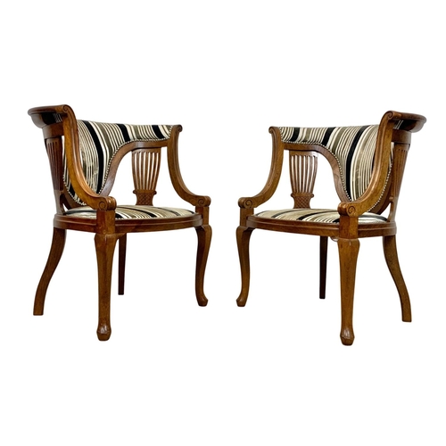 1101 - A pair of Edwardian mahogany tub armchairs