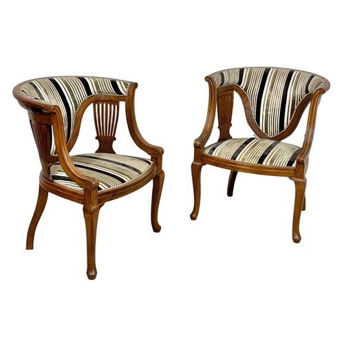 1101 - A pair of Edwardian mahogany tub armchairs