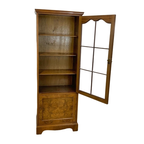 1108 - A vintage walnut bookcase. 60x37x165cm