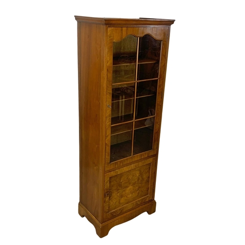 1108 - A vintage walnut bookcase. 60x37x165cm