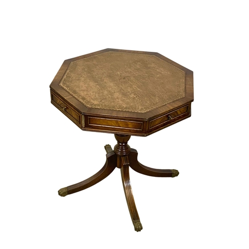 1118 - A mahogany revolving drum table with a leather top in the Georgian style.  61x66cm