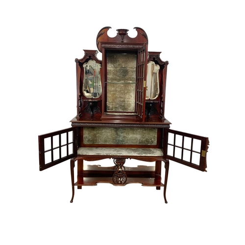 1001 - An Edwardian ornate mahogany display cabinet with fretwork carving. 116.5 x 41.5 x 209cm.