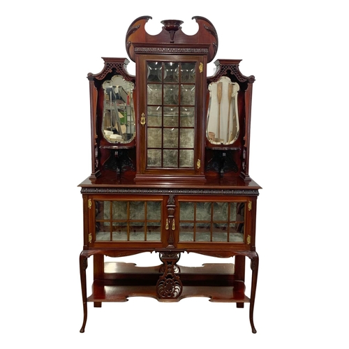 1001 - An Edwardian ornate mahogany display cabinet with fretwork carving. 116.5 x 41.5 x 209cm.