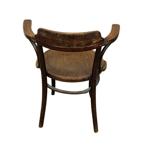 1004 - An early 20th century Bentwood armchair. 66 x 50 x 81cm