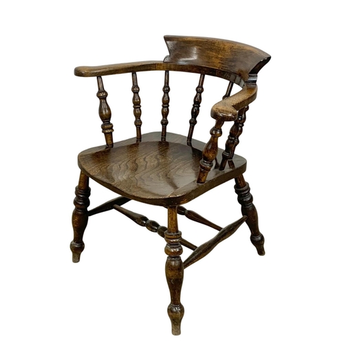 1005 - A Victorian elm and beech armchair.