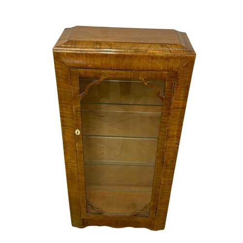 1006 - An Art Deco walnut china cabinet with 4 glass shelves. 1930-1950. 61 x 26.5 x 123cm.