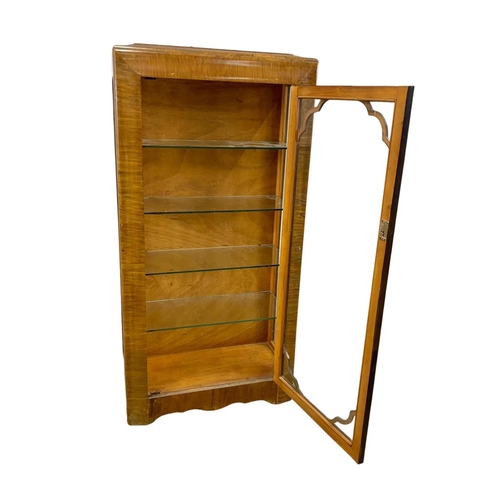 1006 - An Art Deco walnut china cabinet with 4 glass shelves. 1930-1950. 61 x 26.5 x 123cm.