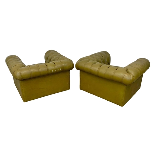 1009 - A pair of large deep button leather Chesterfield club armchairs. 110 x 100 x 66.5cm.