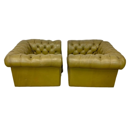 1009 - A pair of large deep button leather Chesterfield club armchairs. 110 x 100 x 66.5cm.