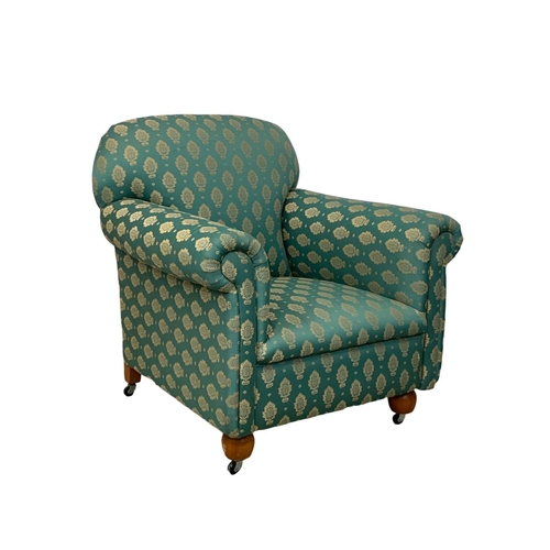 1010 - A 2 piece Victorian style suite. Including a 2 seater sofa and a matching armchair. Sofa measures 14... 