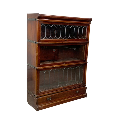 1015 - An early 20th century Globe Wernicke mahogany stacking bookcase. Circa 1910-1920. 86.5 x 31.5 x 120.... 