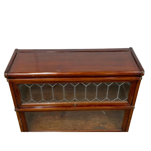 1015 - An early 20th century Globe Wernicke mahogany stacking bookcase. Circa 1910-1920. 86.5 x 31.5 x 120.... 