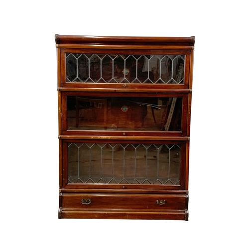 1015 - An early 20th century Globe Wernicke mahogany stacking bookcase. Circa 1910-1920. 86.5 x 31.5 x 120.... 