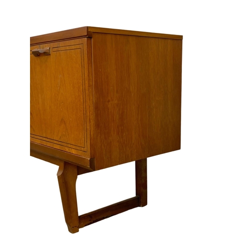 1016 - A teak sideboard with 3 drawers and cocktail cupboard. Mid Century. 1970.  161 x 45.5 x 72.5cm