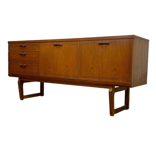 1016 - A teak sideboard with 3 drawers and cocktail cupboard. Mid Century. 1970.  161 x 45.5 x 72.5cm