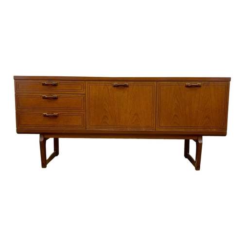 1016 - A teak sideboard with 3 drawers and cocktail cupboard. Mid Century. 1970.  161 x 45.5 x 72.5cm