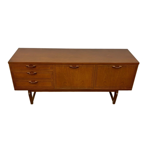 1016 - A teak sideboard with 3 drawers and cocktail cupboard. Mid Century. 1970.  161 x 45.5 x 72.5cm