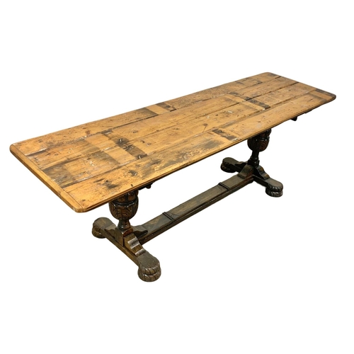 1020 - A large refractory style table. 221 x 64 x 77cm.