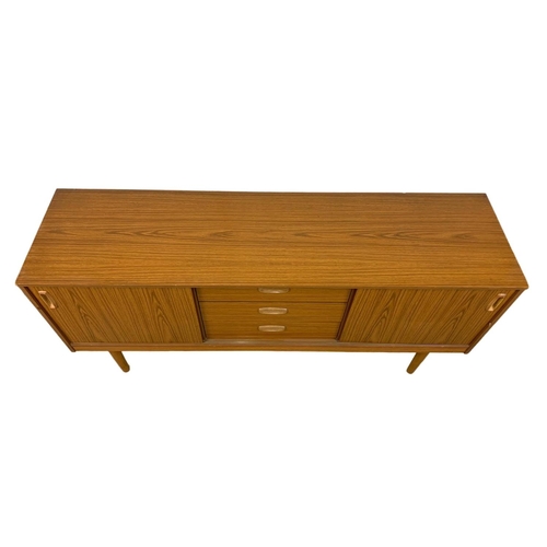 1021 - A Mid Century sideboard by Schreiber. 152 x 41 x 73cm.