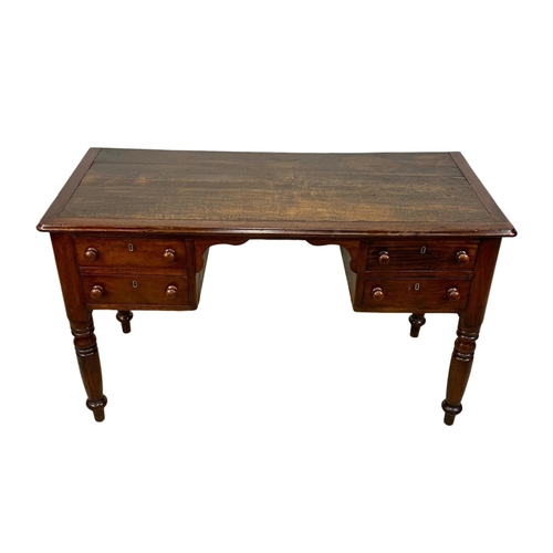 1028 - A Victorian mahogany leather top writing desk with 4 drawers. Circa 1860-1870. 126 x 56.5 x 76cm.