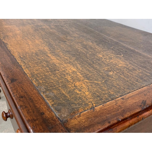 1028 - A Victorian mahogany leather top writing desk with 4 drawers. Circa 1860-1870. 126 x 56.5 x 76cm.