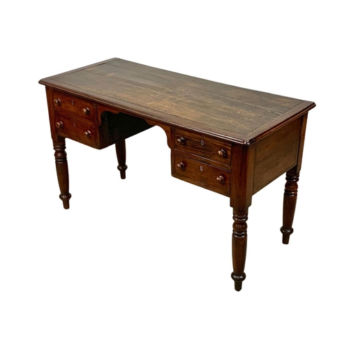 1028 - A Victorian mahogany leather top writing desk with 4 drawers. Circa 1860-1870. 126 x 56.5 x 76cm.