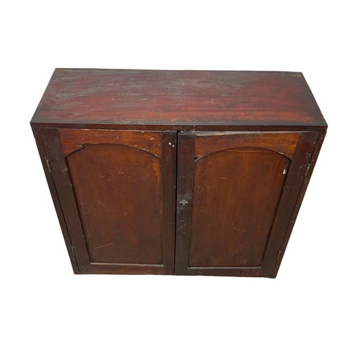 1034 - A Victorian pine 2 door cupboard with 2 drawers and 2 shelves. Circa 1870-1880. 86.5 x 32.5 x 81.5cm