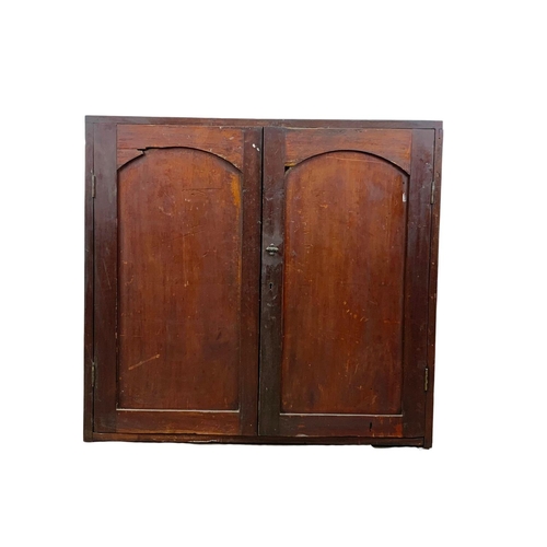 1034 - A Victorian pine 2 door cupboard with 2 drawers and 2 shelves. Circa 1870-1880. 86.5 x 32.5 x 81.5cm