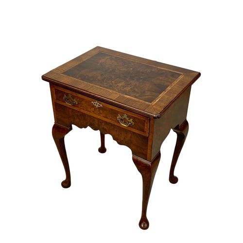 1040 - A Georgian style inlaid walnut lowboy with drawer on cabriole legs. 62 x 45 x 73.5cm