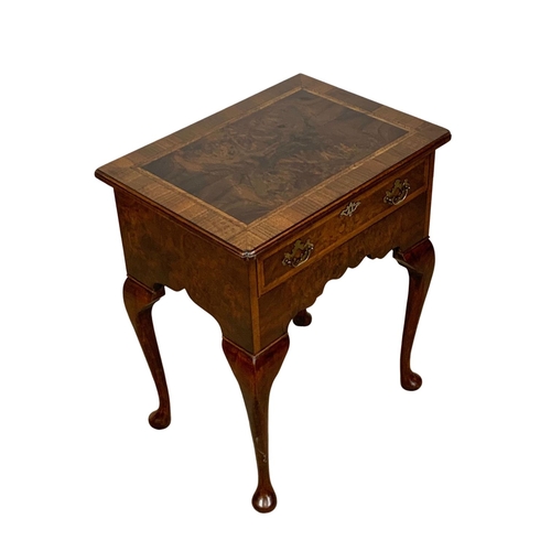 1040 - A Georgian style inlaid walnut lowboy with drawer on cabriole legs. 62 x 45 x 73.5cm