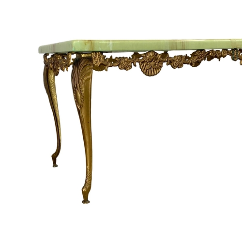 1047 - n ornate brass and faux onyx coffee table. 121.5 x 40 x 40cm.