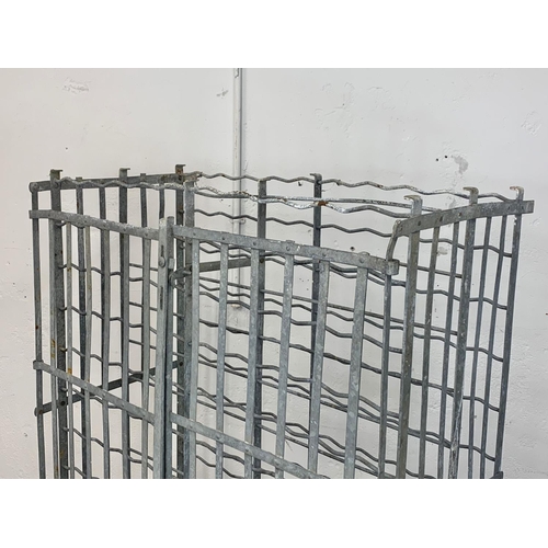 1048 - A large vintage industrial metal double door wine rack. 102 x 55.5 x 162cm.