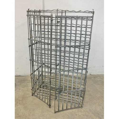 1048 - A large vintage industrial metal double door wine rack. 102 x 55.5 x 162cm.