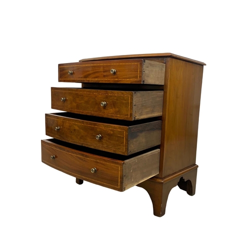 1049 - An Edwardian period inlaid mahogany bow front chest of drawers in the Georgian style. 68 x 45 x 82cm... 