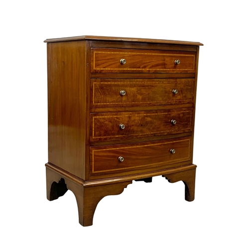 1049 - An Edwardian period inlaid mahogany bow front chest of drawers in the Georgian style. 68 x 45 x 82cm... 