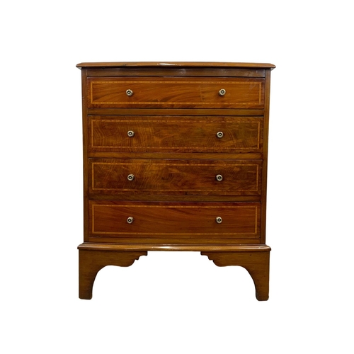 1049 - An Edwardian period inlaid mahogany bow front chest of drawers in the Georgian style. 68 x 45 x 82cm... 