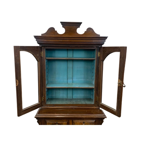 1050 - A late Victorian burr walnut Apprentice bookcase. Circa 1890. 58 x 31 x 128cm