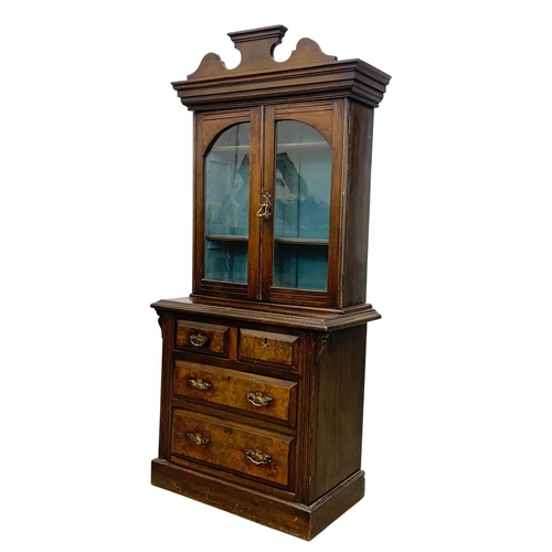 1050 - A late Victorian burr walnut Apprentice bookcase. Circa 1890. 58 x 31 x 128cm