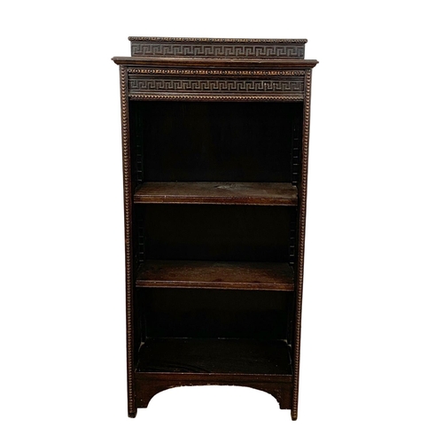 1053 - A 1920’s oak open bookcase with Greek Key moulding. 56 x 30 x 115cm.