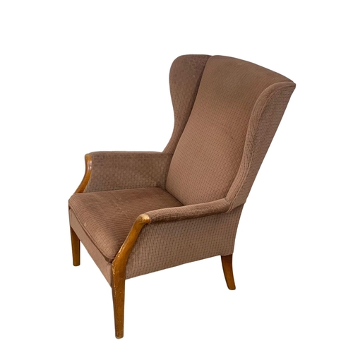 1058 - A vintage Parker Knoll wingback armchair.