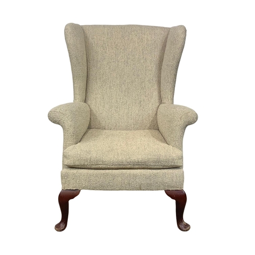 1059 - A vintage Parker Knoll wingback armchair.