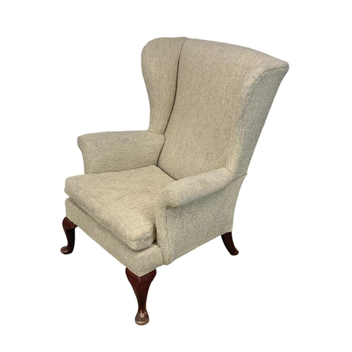 1059 - A vintage Parker Knoll wingback armchair.