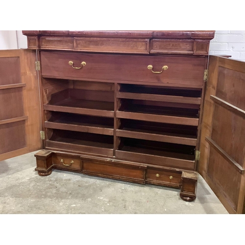 1070 - A large Victorian mahogany combination bookcase and linen cabinet. Circa 1850