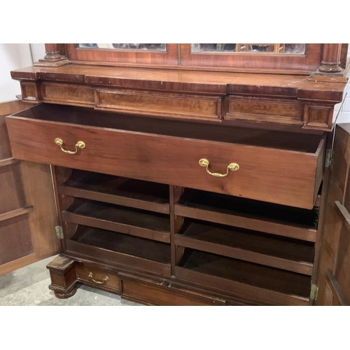 1070 - A large Victorian mahogany combination bookcase and linen cabinet. Circa 1850