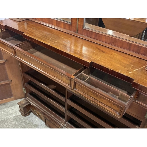 1070 - A large Victorian mahogany combination bookcase and linen cabinet. Circa 1850