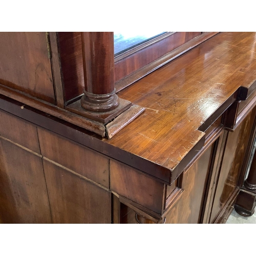 1070 - A large Victorian mahogany combination bookcase and linen cabinet. Circa 1850