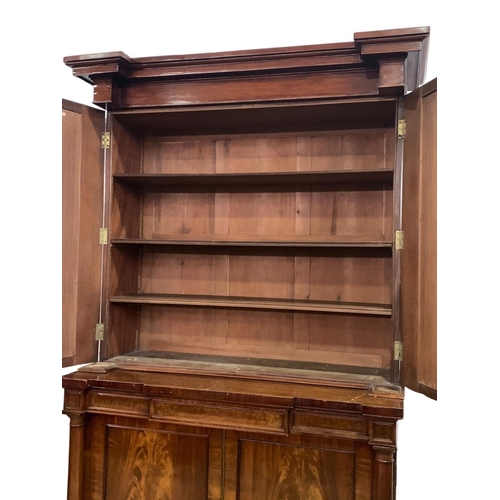 1070 - A large Victorian mahogany combination bookcase and linen cabinet. Circa 1850